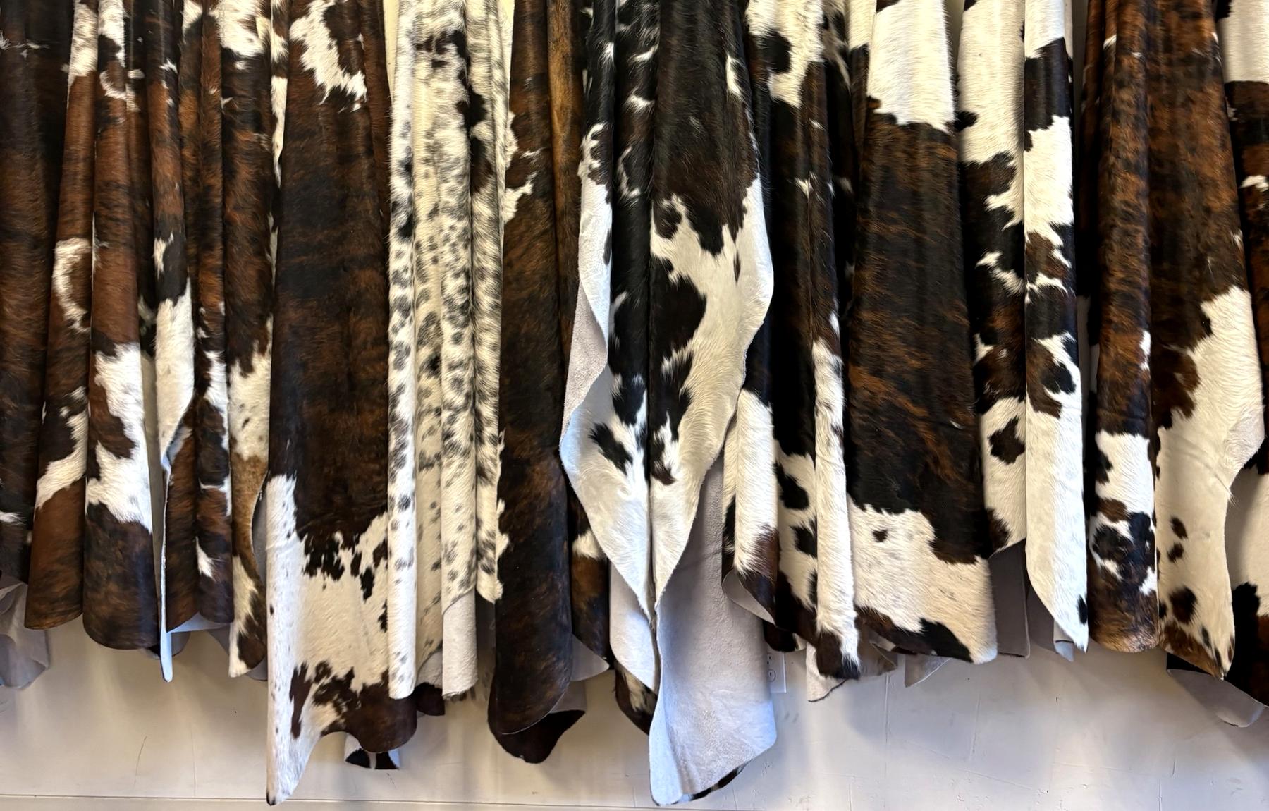 A wall of Brazilian cowhides at the Lonestar Rustic warehouse
